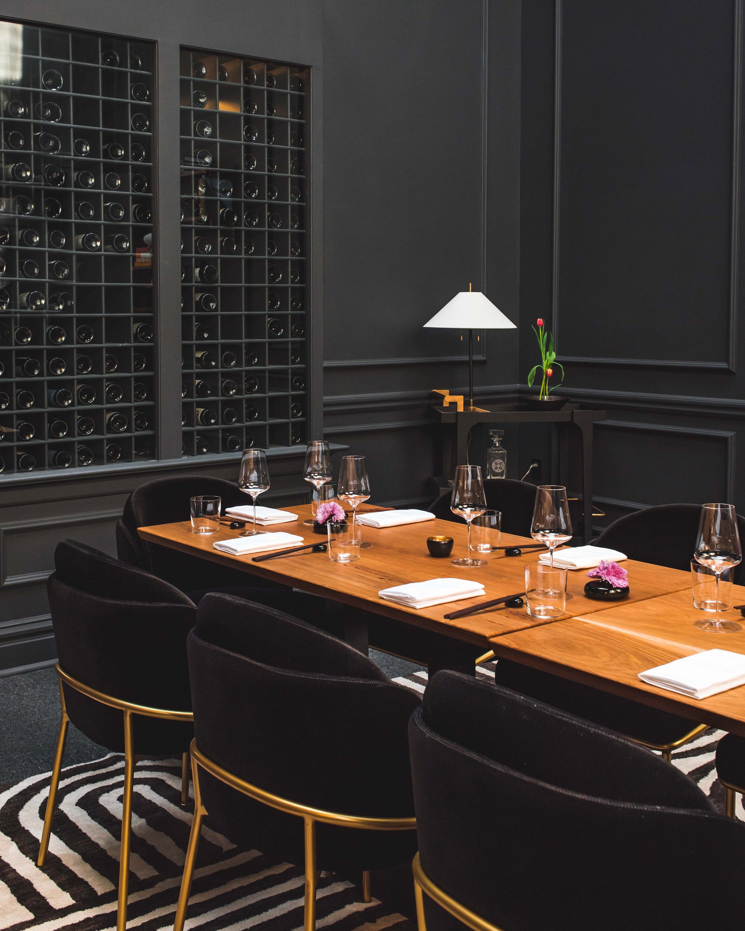 Intimate private dining table at Nisei set with soft light and elegant tableware