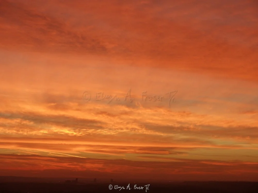 View 310 - deep red and gold clouds glowing at dusk over distant silhouetted horizon, Wildlife, Minnesota USA, Fall 2014