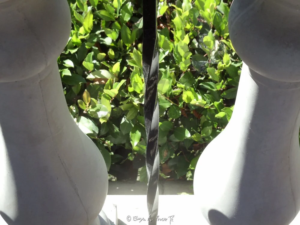 View 336 - black metal helix bar between 2 curved concrete pillars overlooking green plant life, Humanity, Wildlife, California USA, Fall 2014