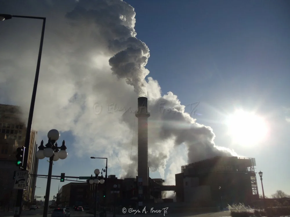 View 378 - large plumes from industrial chimney and building against radiant clear blue sky above street lamps and intersection, Humanity, District Energy St Paul Minnesota USA, Winter 2014/2015