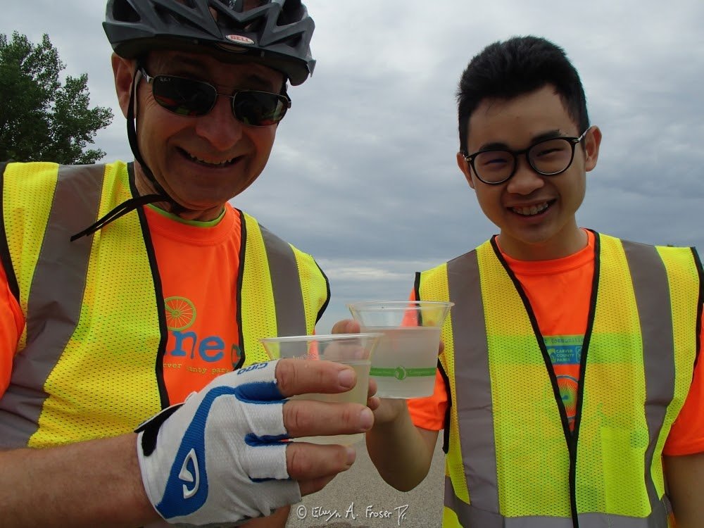 View 495 - Bike Konnect event leaders drinking water together, Humanity, Carver County Minnesota USA, Summer 2016