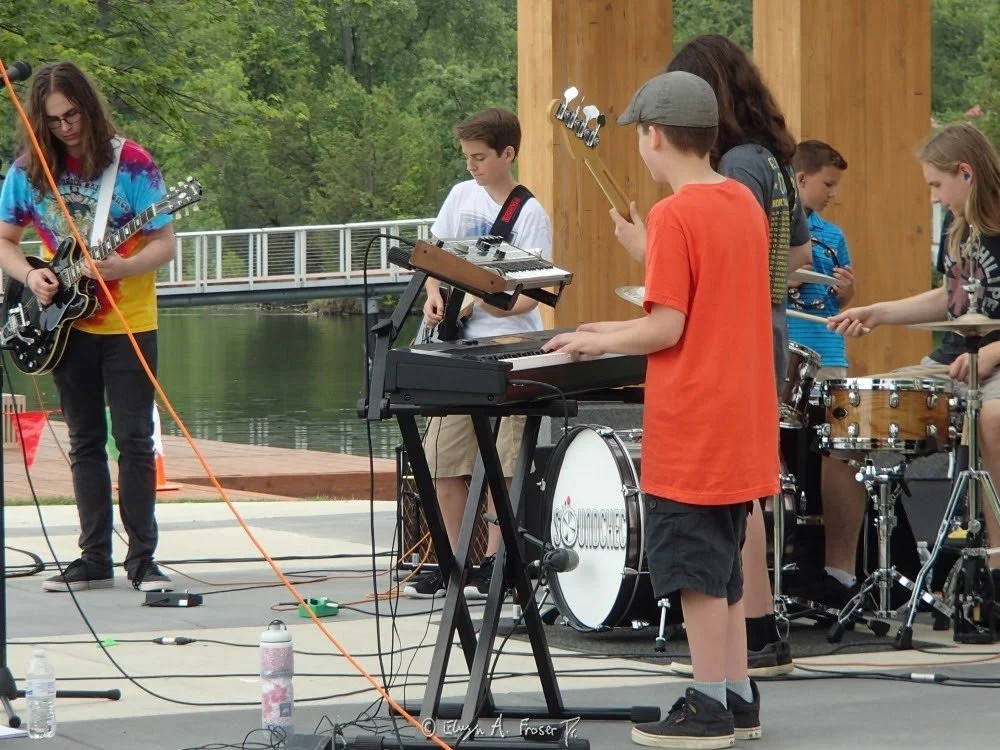 View 502 - youth band playing in band shell, Humanity, Firemen's Park Minnesota USA, Summer 2016