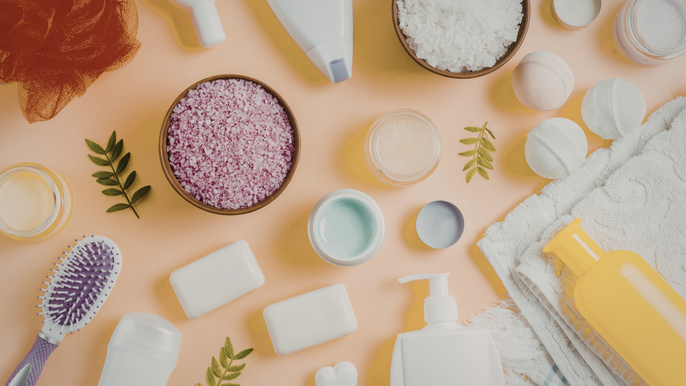 Creams in pink, purple, white, and green colors spread on a flat surface.