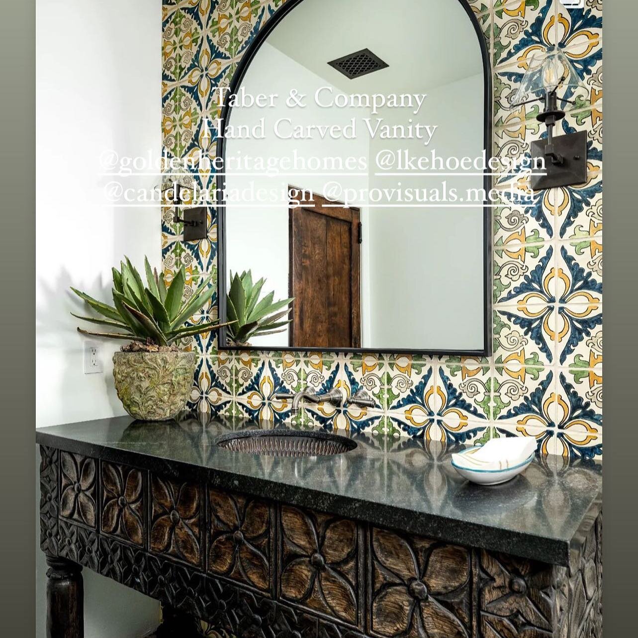 @provisuals.media Beautifully captured this hacienda style home. We created the front door with hand carving as well as the carved vanity and hand forged iron hood. We worked with a very talented team @candelariadesign @goldenheritagehomes @lkehoedes
