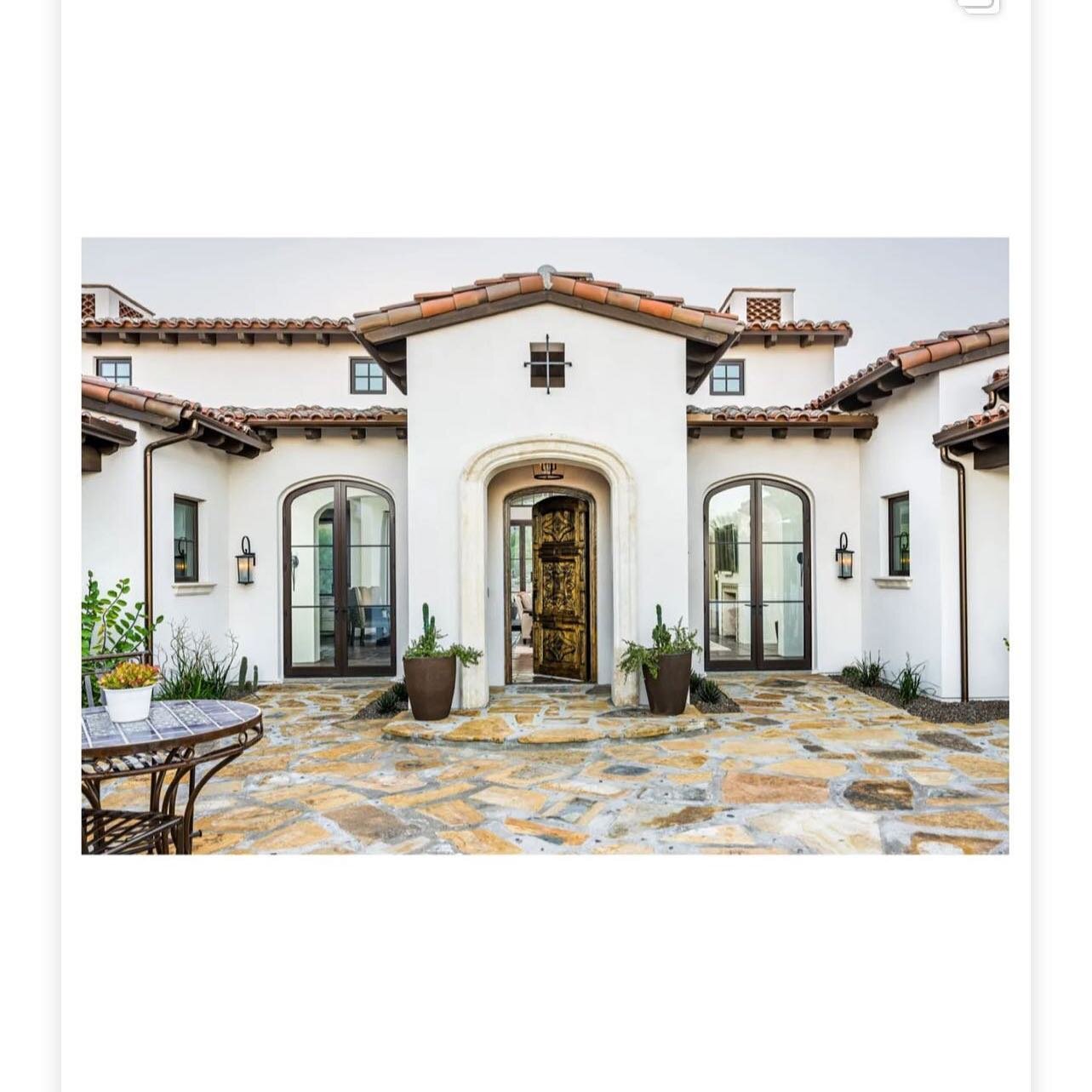 @provisuals.media Beautifully captured this hacienda style home. We created this front door with hand carving as well as the carved vanity and hand forged iron hood. We enjoyed working with this very talented team @candelariadesign @goldenheritagehom