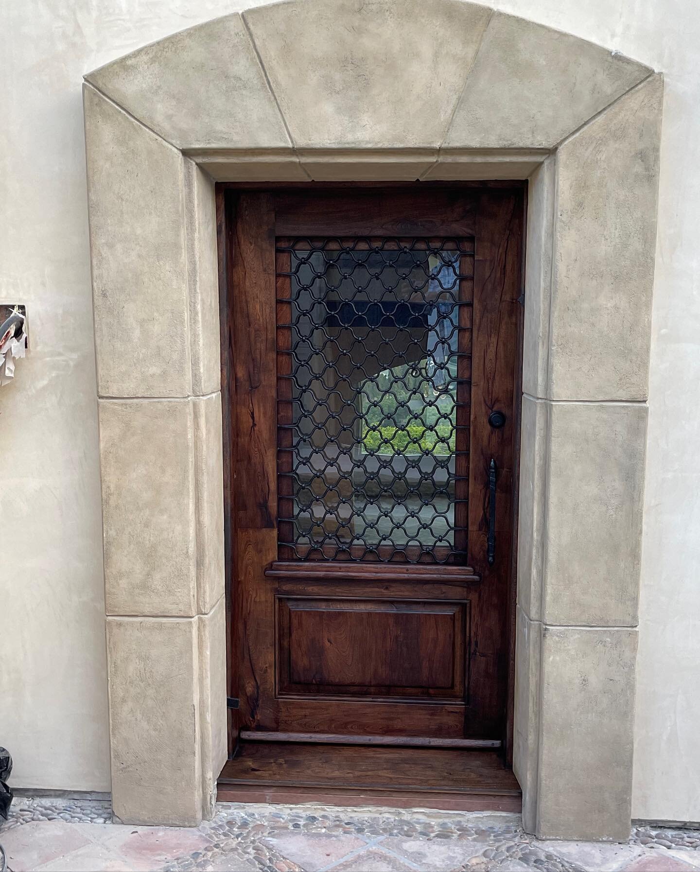 Just installed, this mesquite wood door with iron compliments the entry to this beautiful 1930&rsquo;s California home. #customdoors #doorsofinstagram #exteriordesign #californiahomes #architecture #beautifulhomes #doors #craftsmanship #iconicarchite