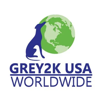 Logo of GREYK2K USA Worldwide featuring a blue dog silhouette and a green globe.