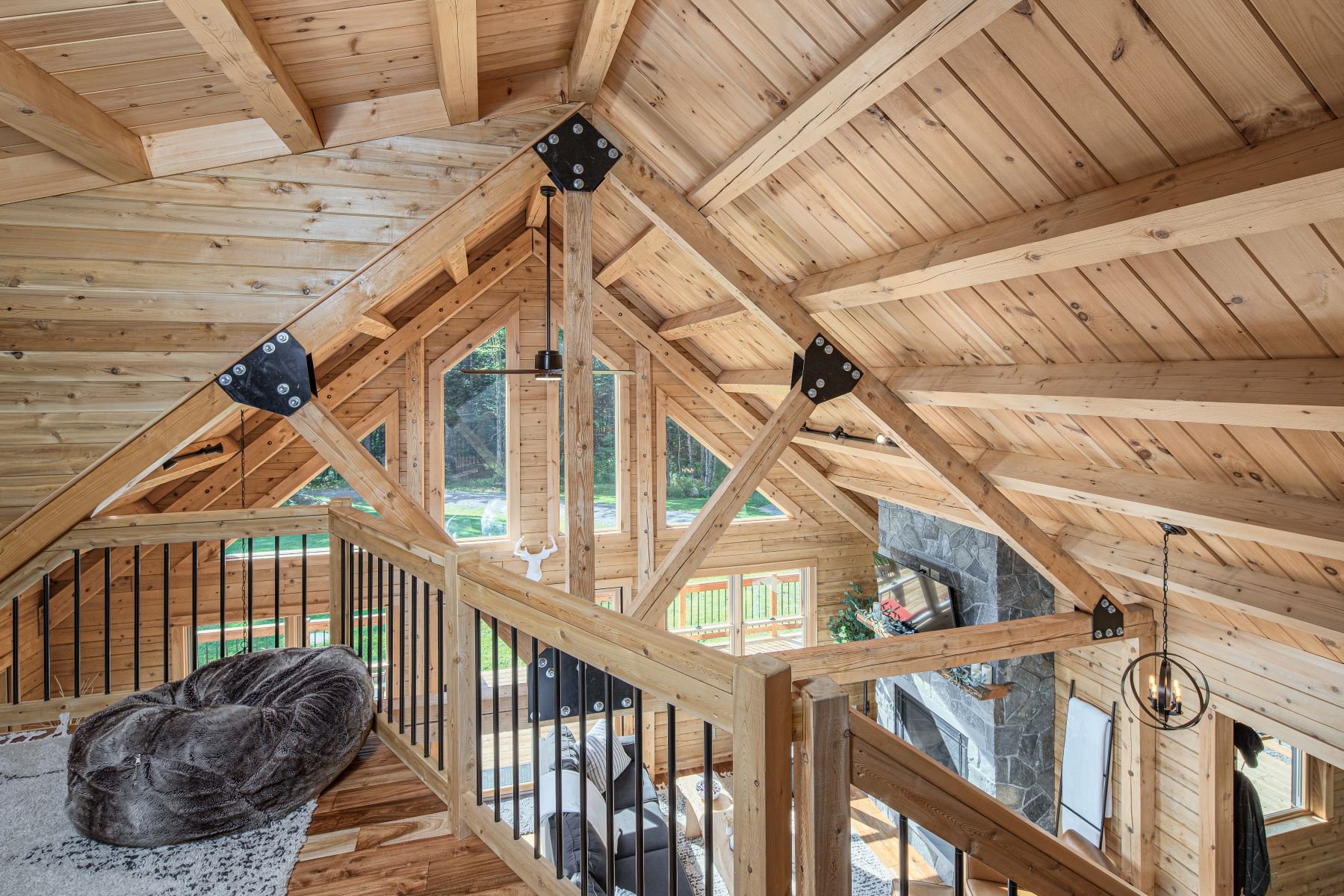 The loft offers a spectacular view of the craftsmanship and classic construction of a cedar log home.
