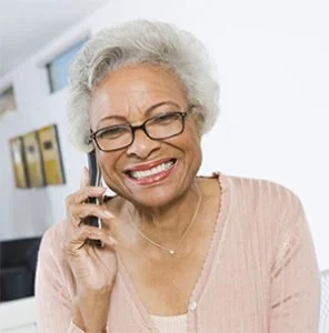 Image of smiling woman talking on phone