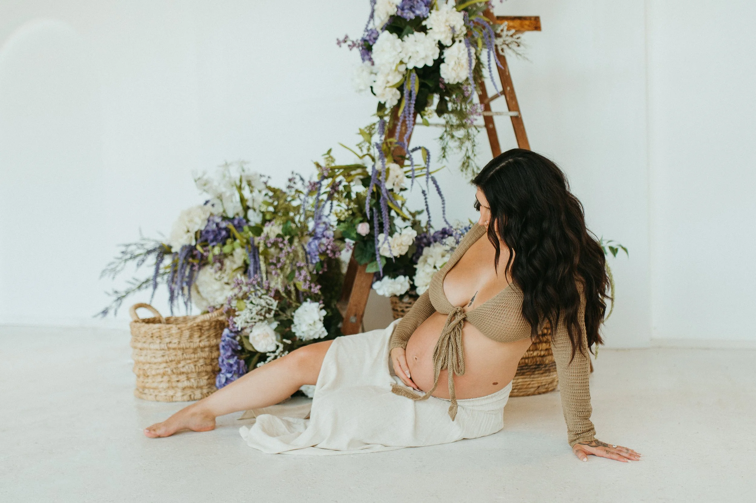 studio maternity photoshoot spring floral installation
