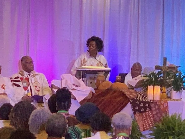 Bishop Moore-Koikoi at Communion service.jpg