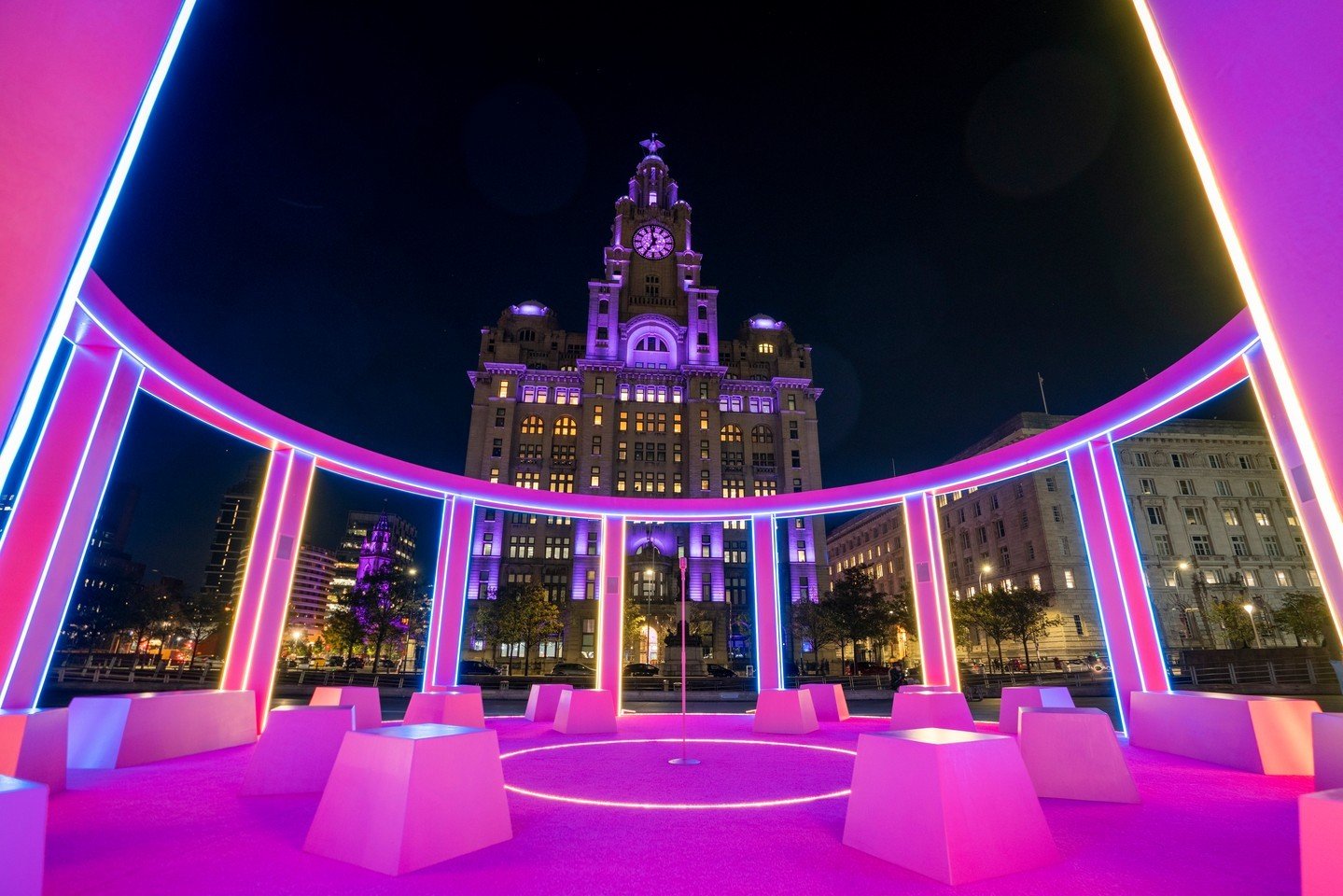 LED Creative Illuminated Liverpool Waterfront with this radiant pink tribute to the music of Eurovision 2023. 
Designed by @yellowstudionyc , who also designed the Eurovision set from earlier in the year, created this captivating light-up art install