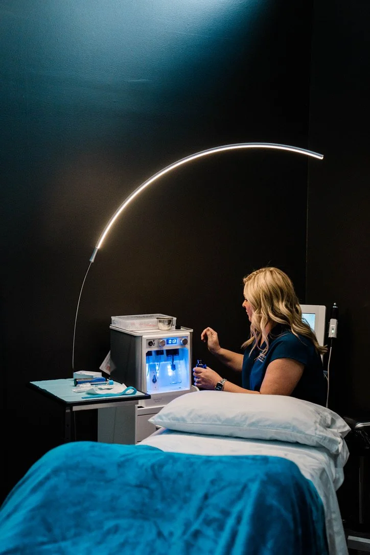 A provider at A Younger You aesthetics sitting in front of a medical grade skincare tools awaiting a patient for a luxury skin care treatment