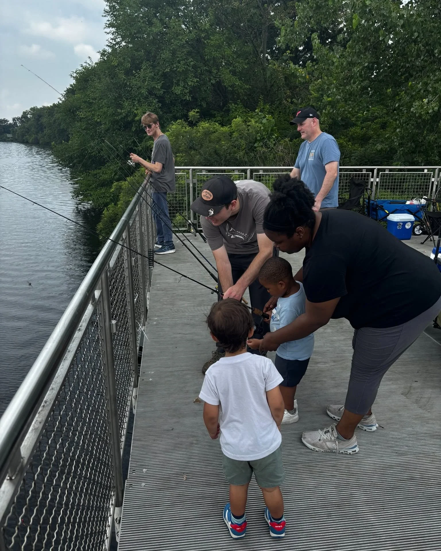 Family learning how to fish.
