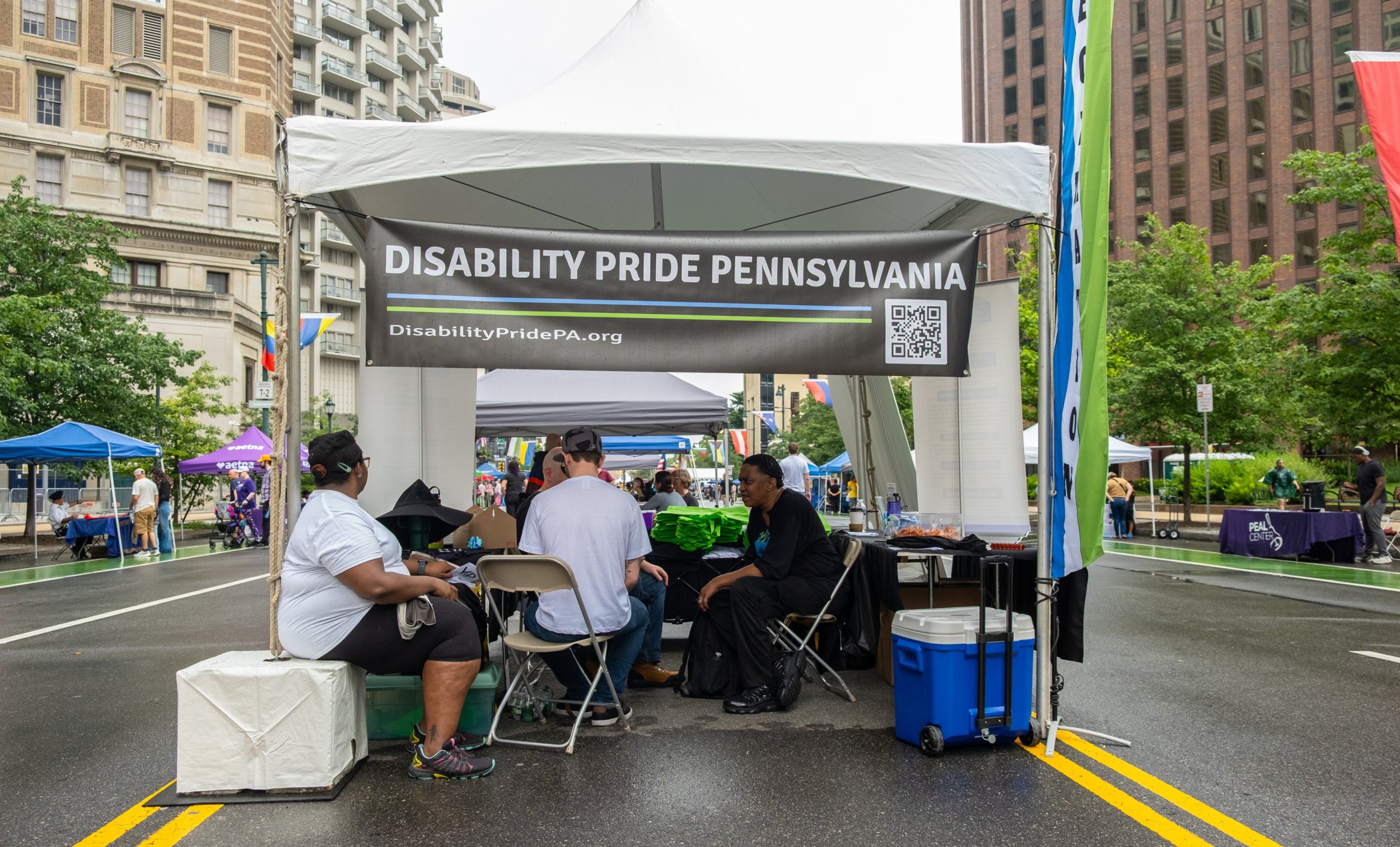 Crowded Disability Pride Booth