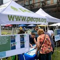 Pennsylvania Environmental Council table and tent set up in a grassy area