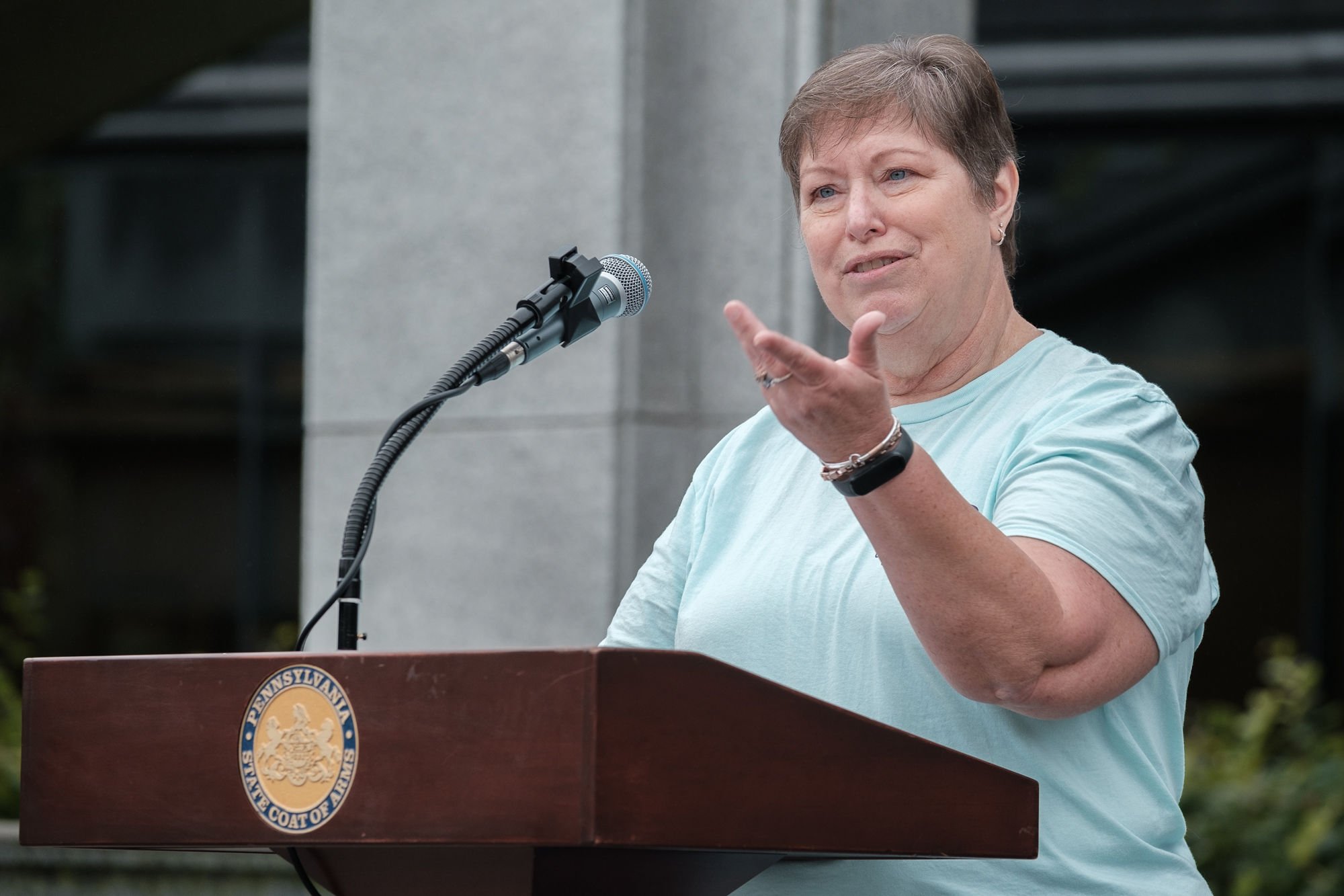 Janetta Green in front of the podium at the Capitol Building speaking at Disability Pride Central PA