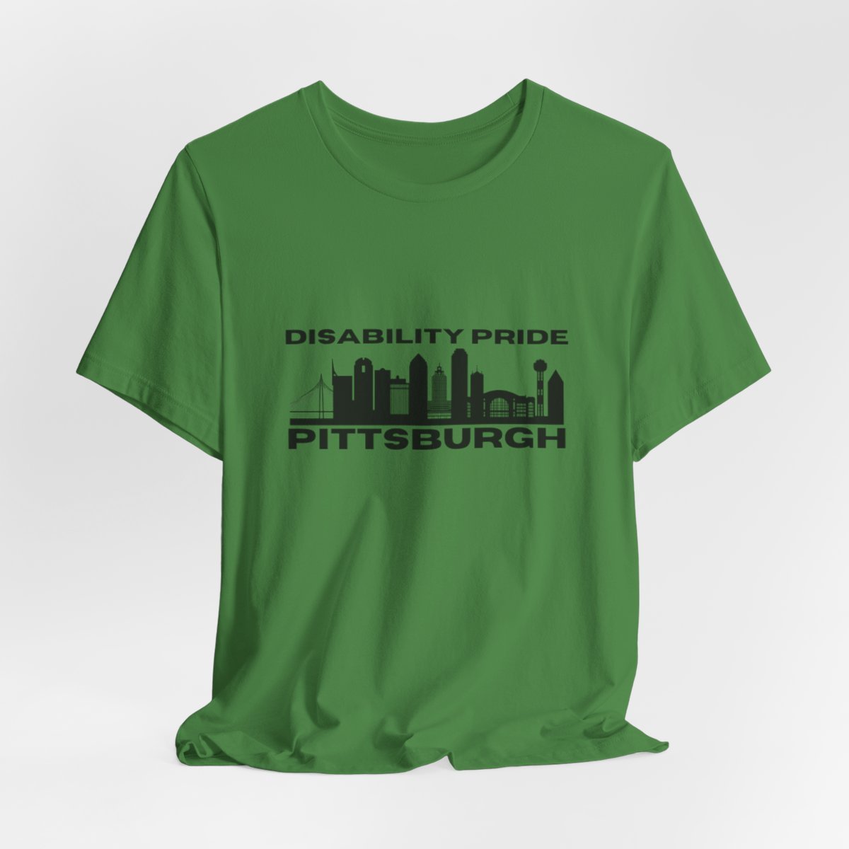 Green tee with black Disability Pride Pittsburgh logo