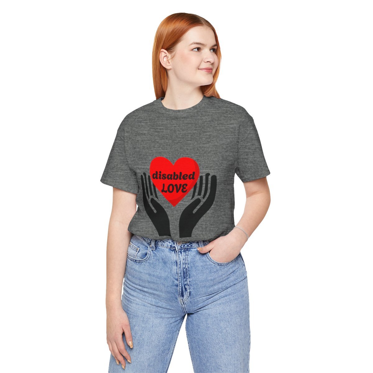 Person in heather gray shirt with two black hands holding a red heart that says disabled joy.