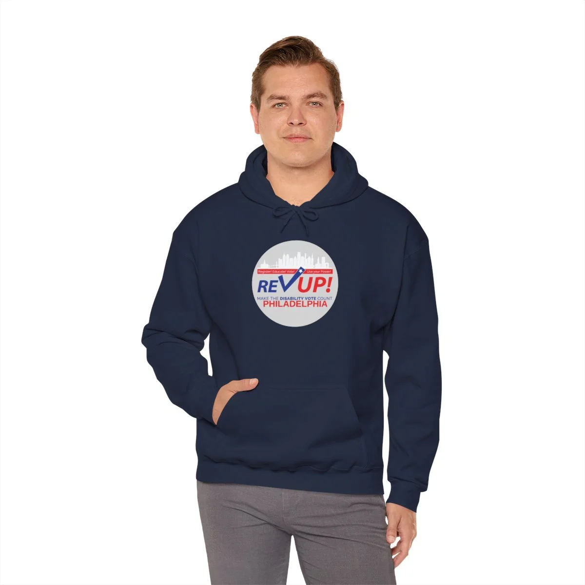 A person wearing a navy hoodie with Rev Up Philly hoodie