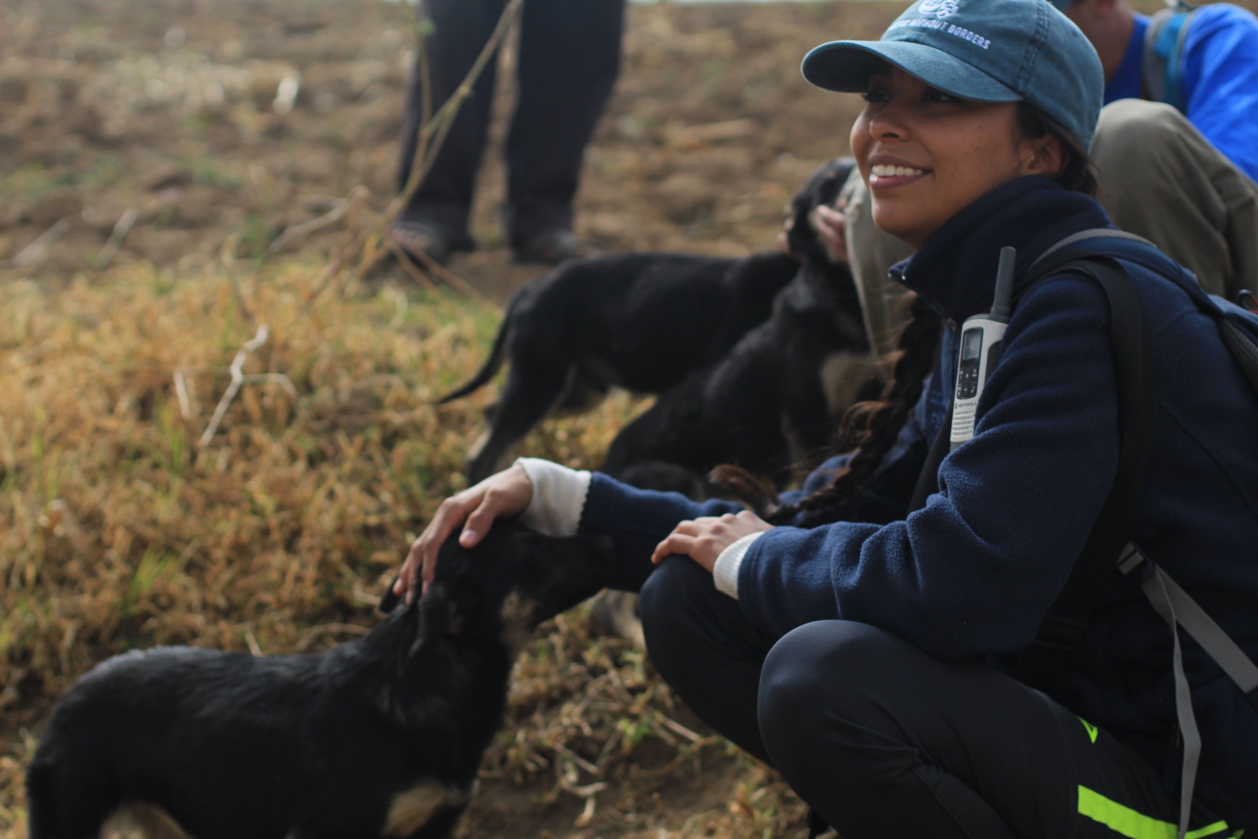  Yulissa gets to know a puppy friend. 