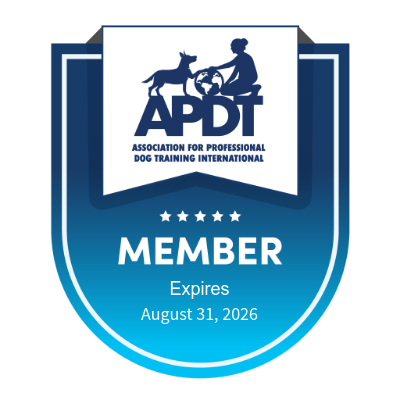 A membership badge for the Association for Professional Dog Training International featuring the ADPT logo, a silhouette of a person with a dog and a ball, with the word 'MEMBER' and expiration date August 31, 2026.