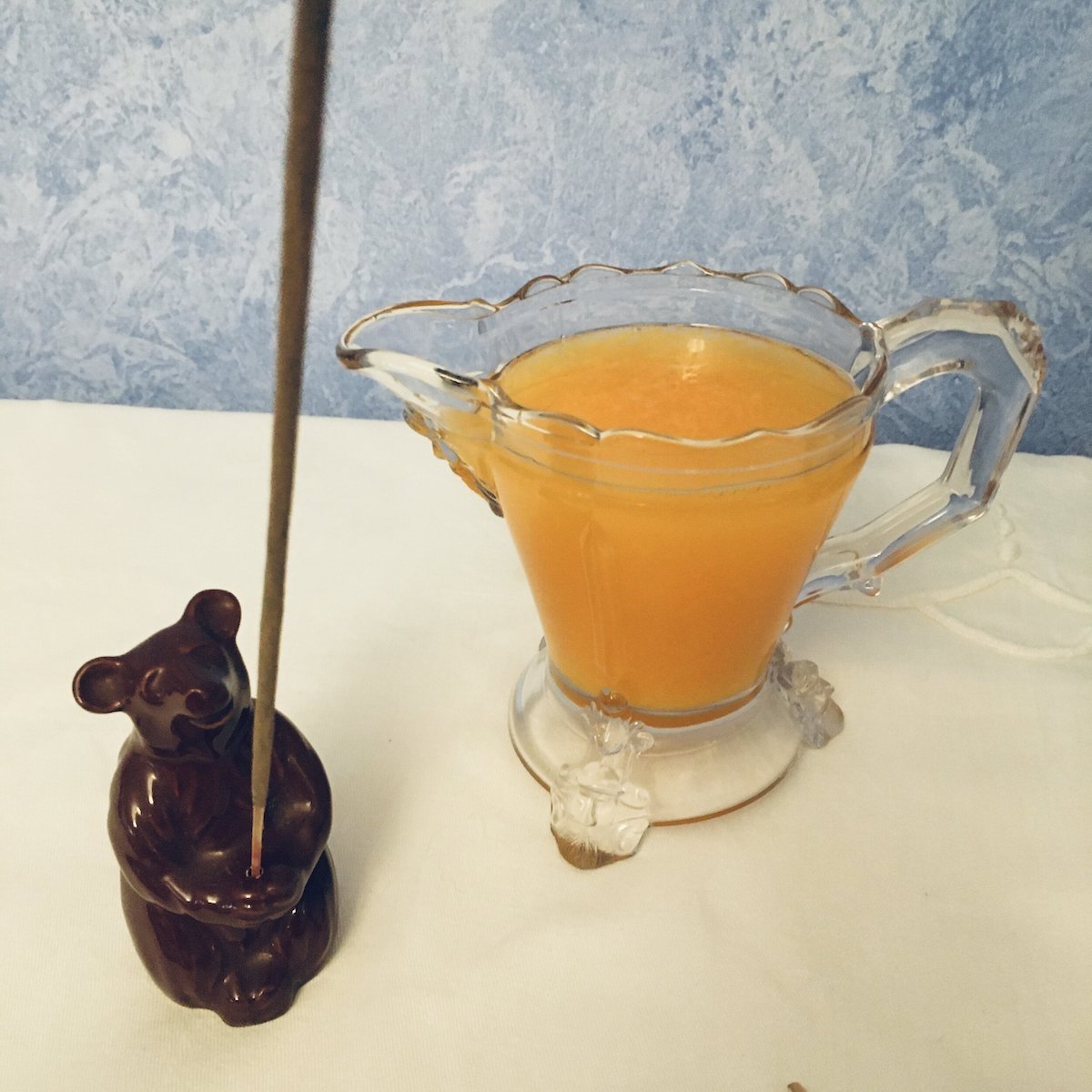 Incense holder and antique glass pitcher