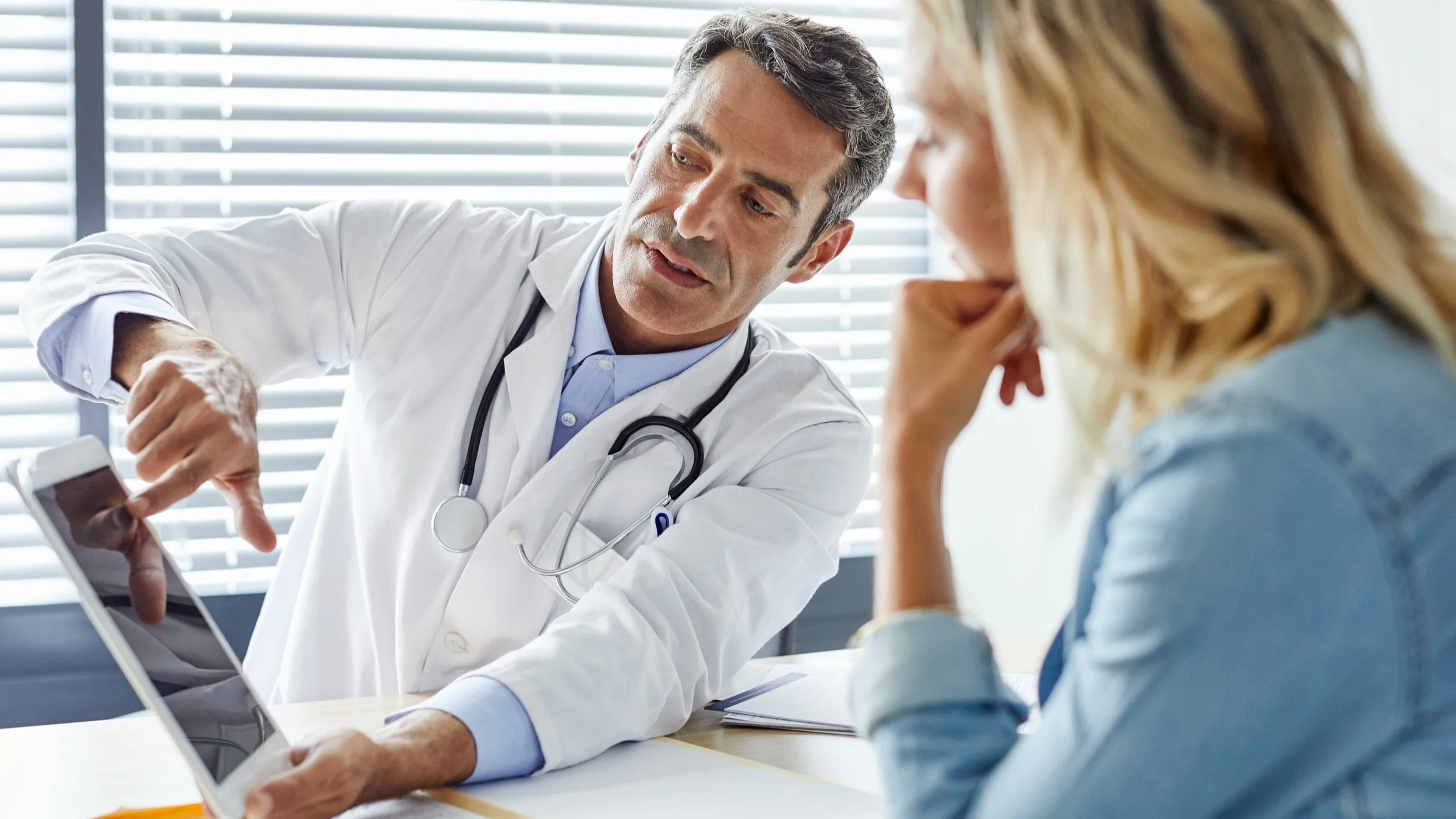 A doctor explaining health data to a patient