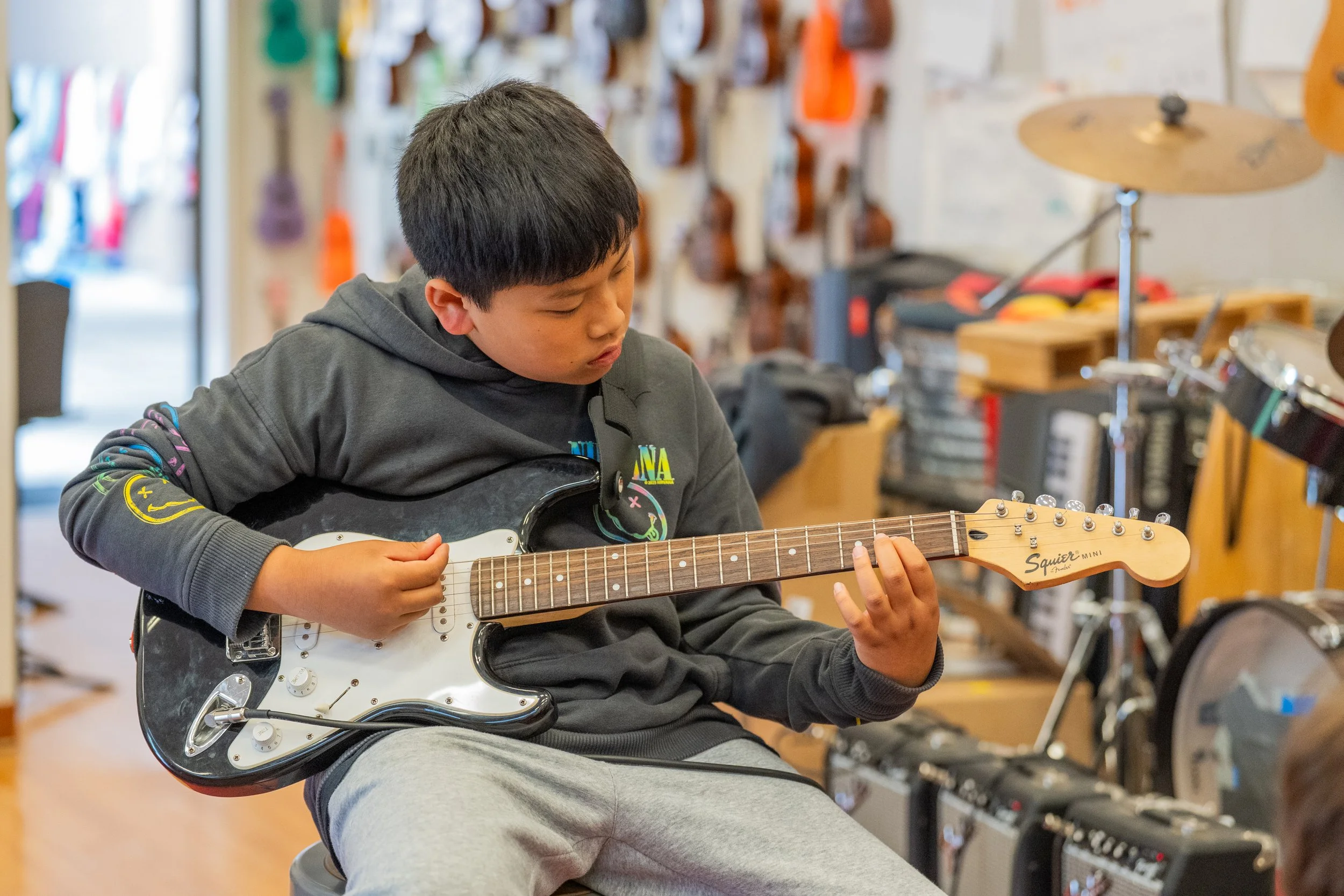 Encinal student playing guitar
