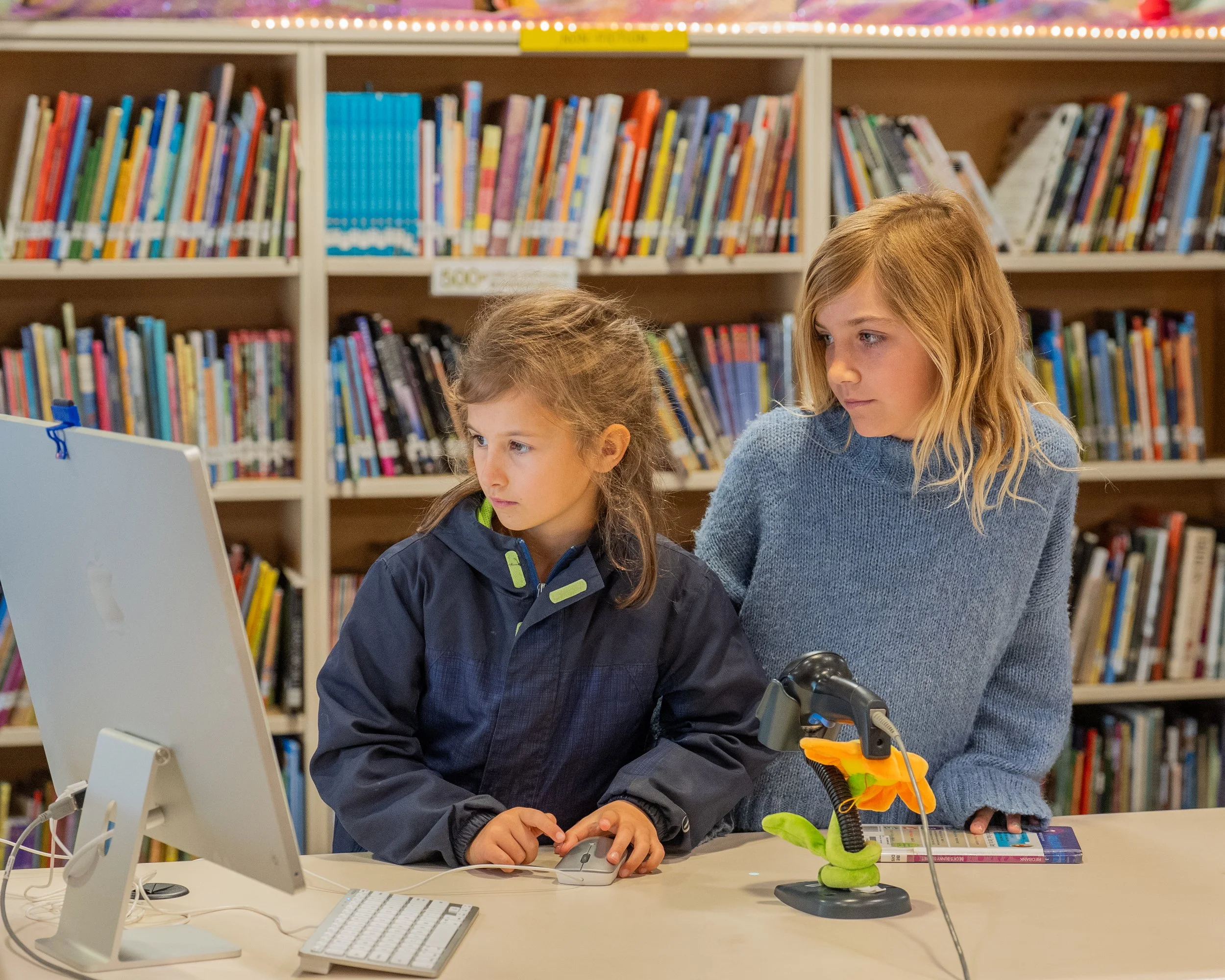 Encinal students in library working on a computer