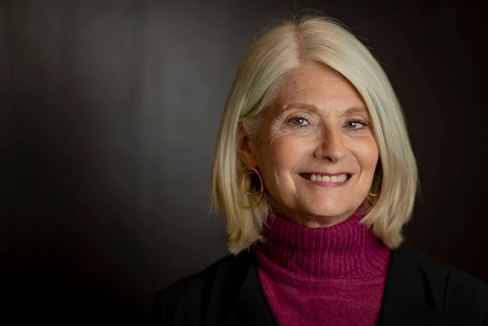 Gail Golden portrait wearing burgundy turtleneck sweater