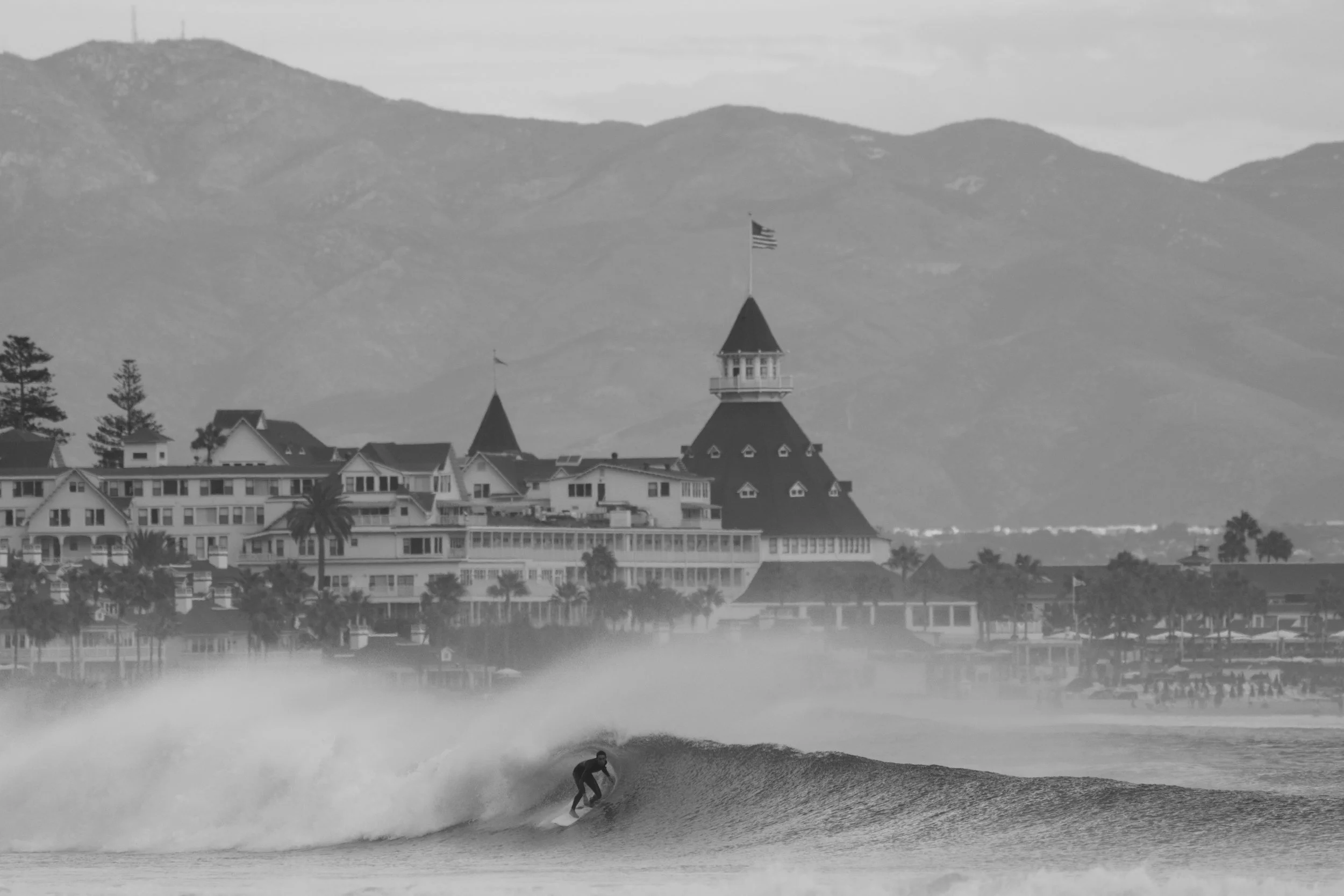 Surfing Hurricane Marie Swell Hotel Del Coronado in background. Coronado CA. 