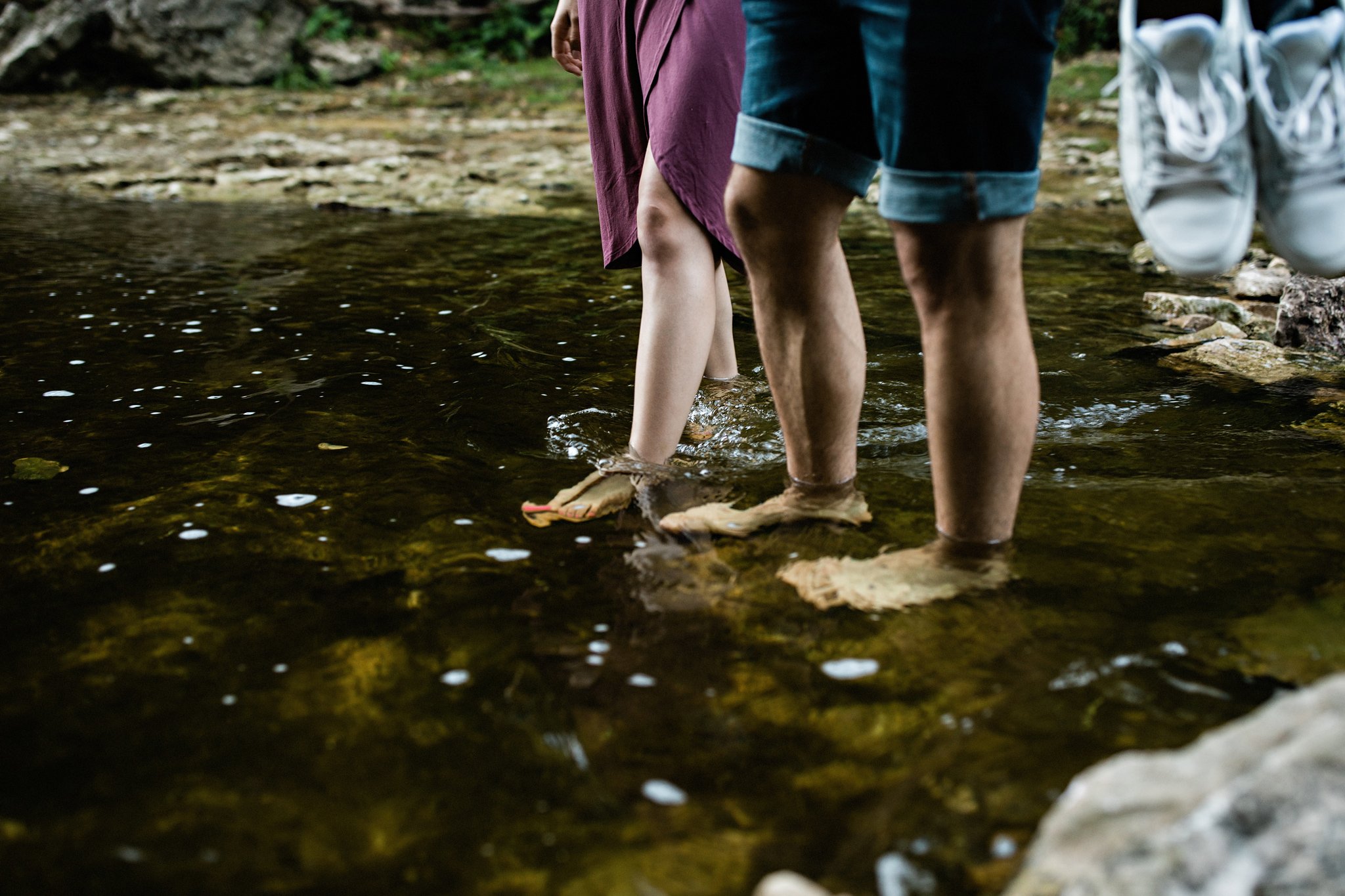231-walking-across-the-river-during-an-elora-gorge-sunset-engagement-session.jpg