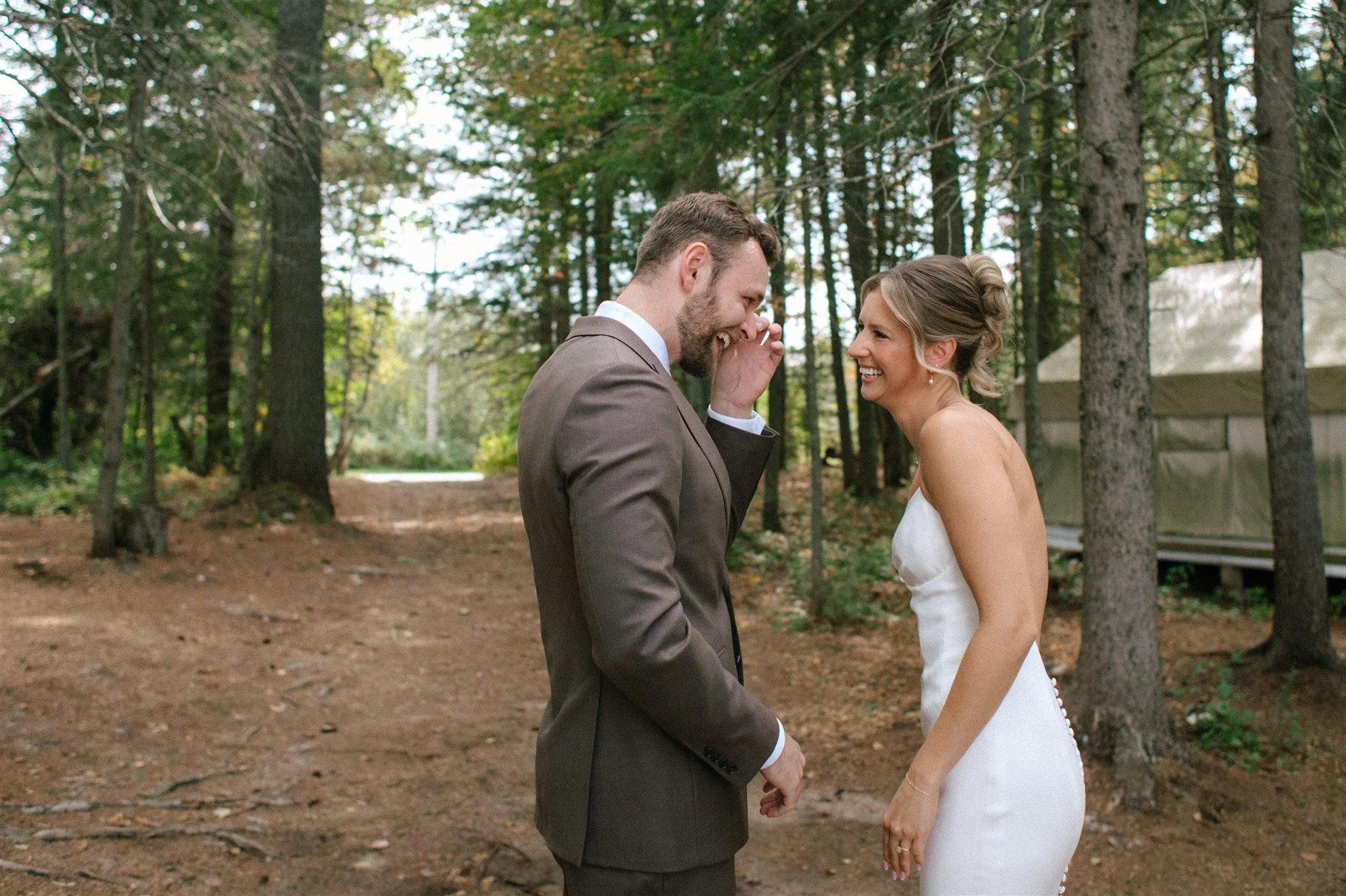 Emotional first look in the forest at Northridge Inn wedding