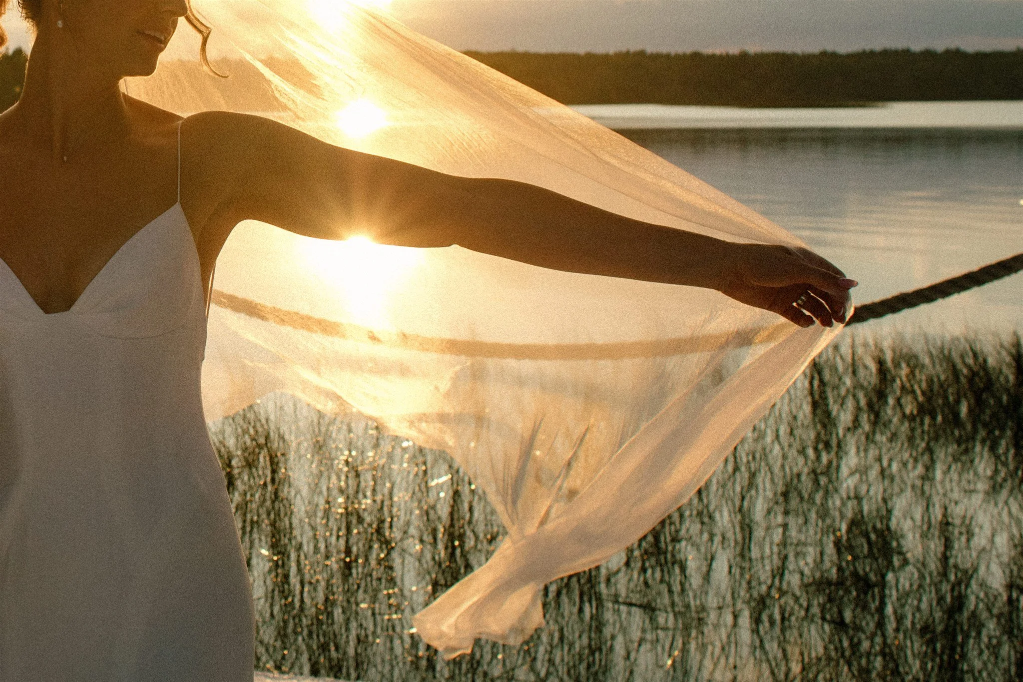 Veil detail at sunset on the dock during a Northridge Inn wedding