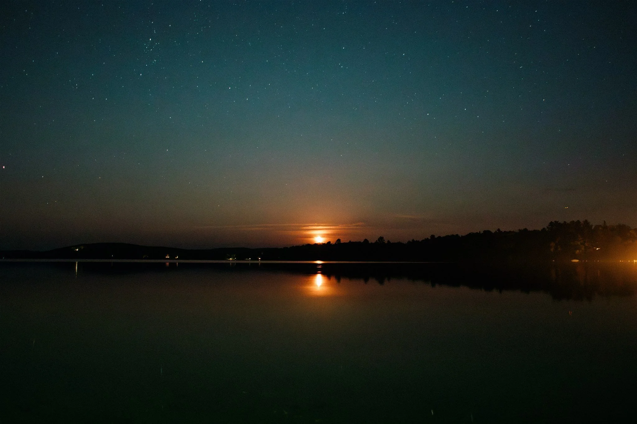 Stars reflecting over the lake at night at a Northridge Inn wedding in Sundridge Ontario