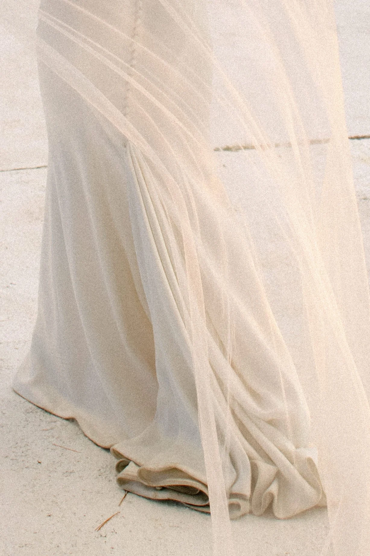 Bride’s wedding dress button detail by Bisou Bridal soft sunset light at Northridge Inn