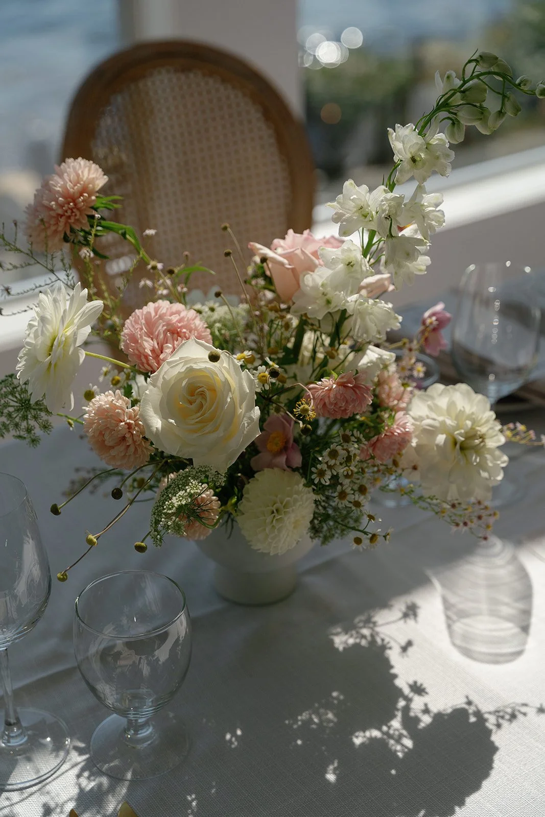 coastal inspired wedding floral design with soft pastel blooms