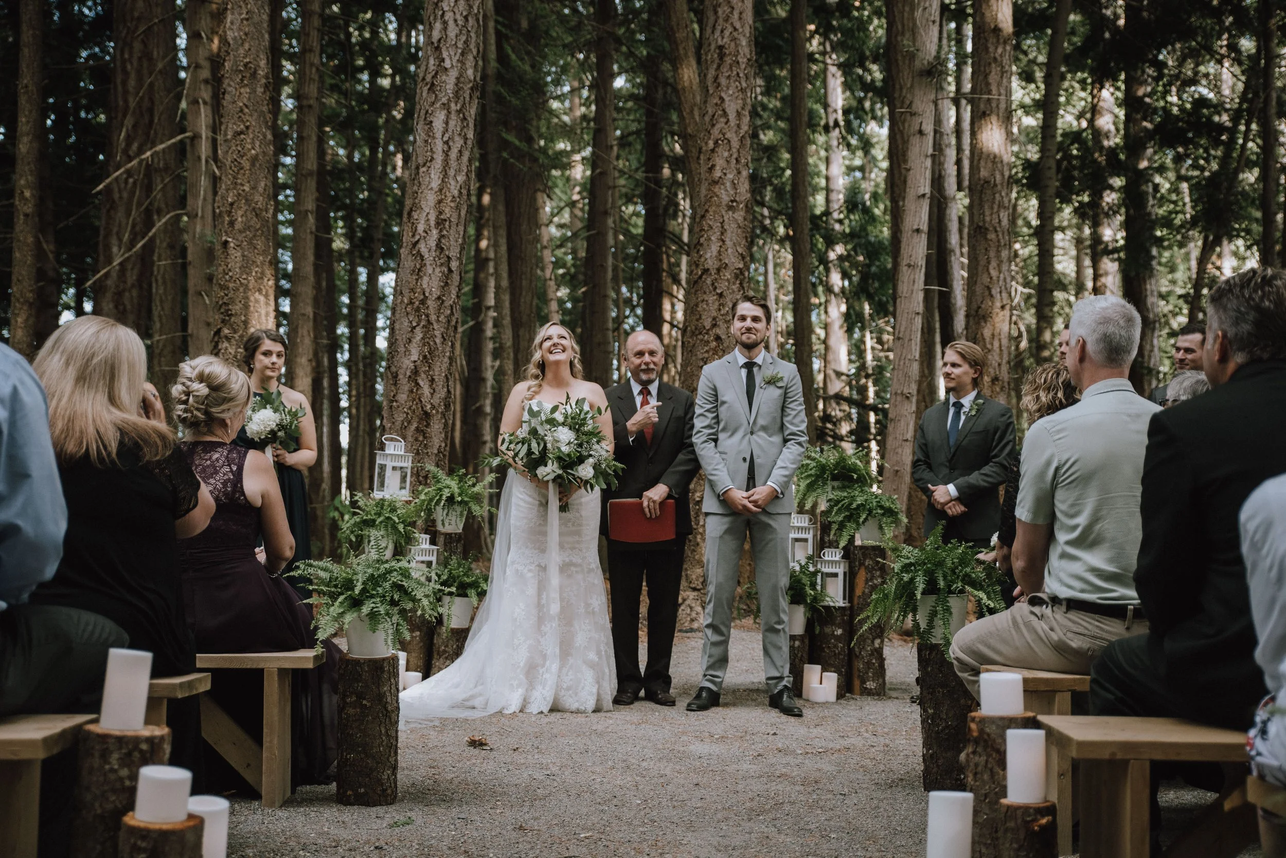 bride and groom at alter in the forest