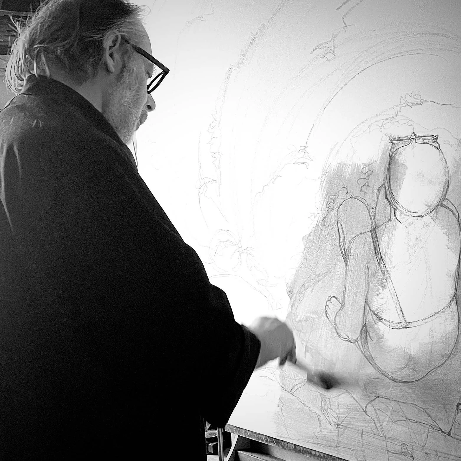 Contemporary figurative painter Alain Rouschmeyer drawing the human figure in his studio