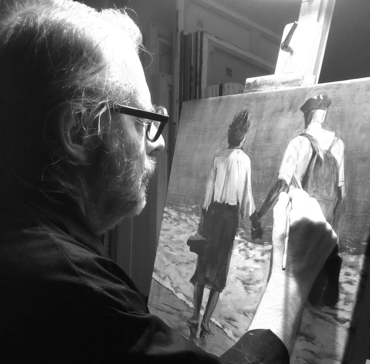 Alain Rouschmeyer peintre figuratif contemporain en atelier travaillant un tableau figuratif contemporain