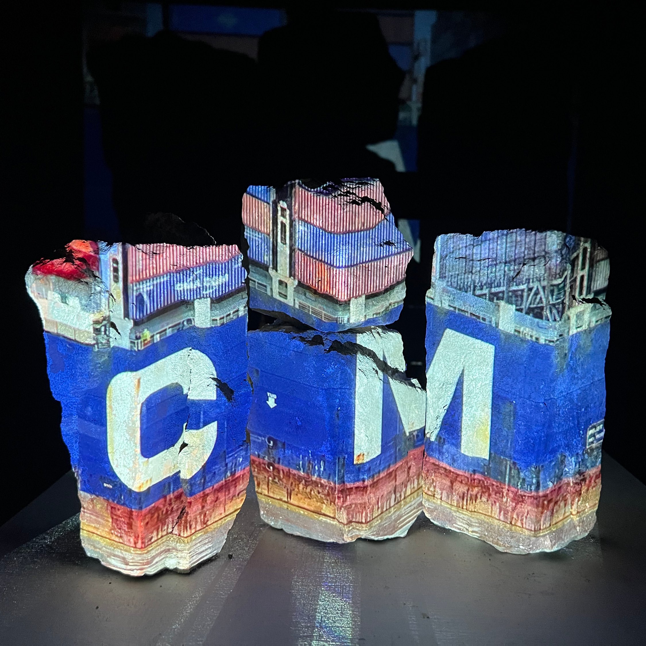 Structural Bricks from Alexander Hall, Resting on Fiber Cement Pedestal, with Video Projection