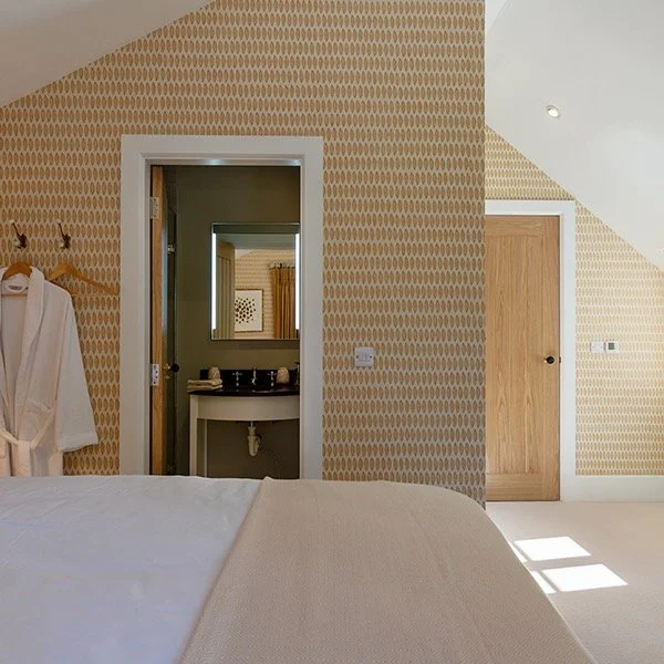 Just a nice tidy loft bedroom and ensuite as part of an out-building conversion. Photo by @karen_dempsey_photography , hope it didn't take too long to get that bed linen looking so crisp!