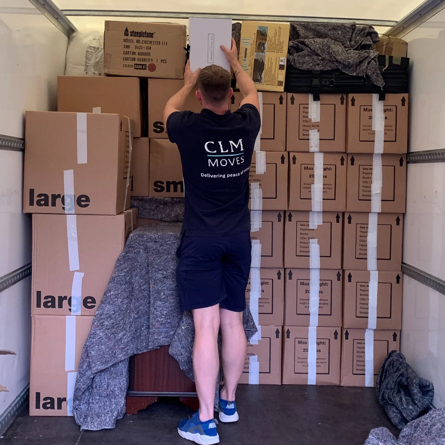 CLM Moves crew loading a van