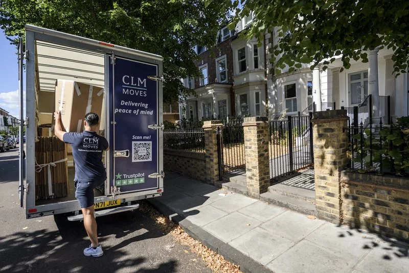Branded CLM Moves van on a London street