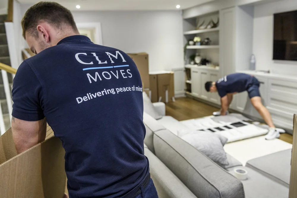 CLM Moves crew working inside a styled living room