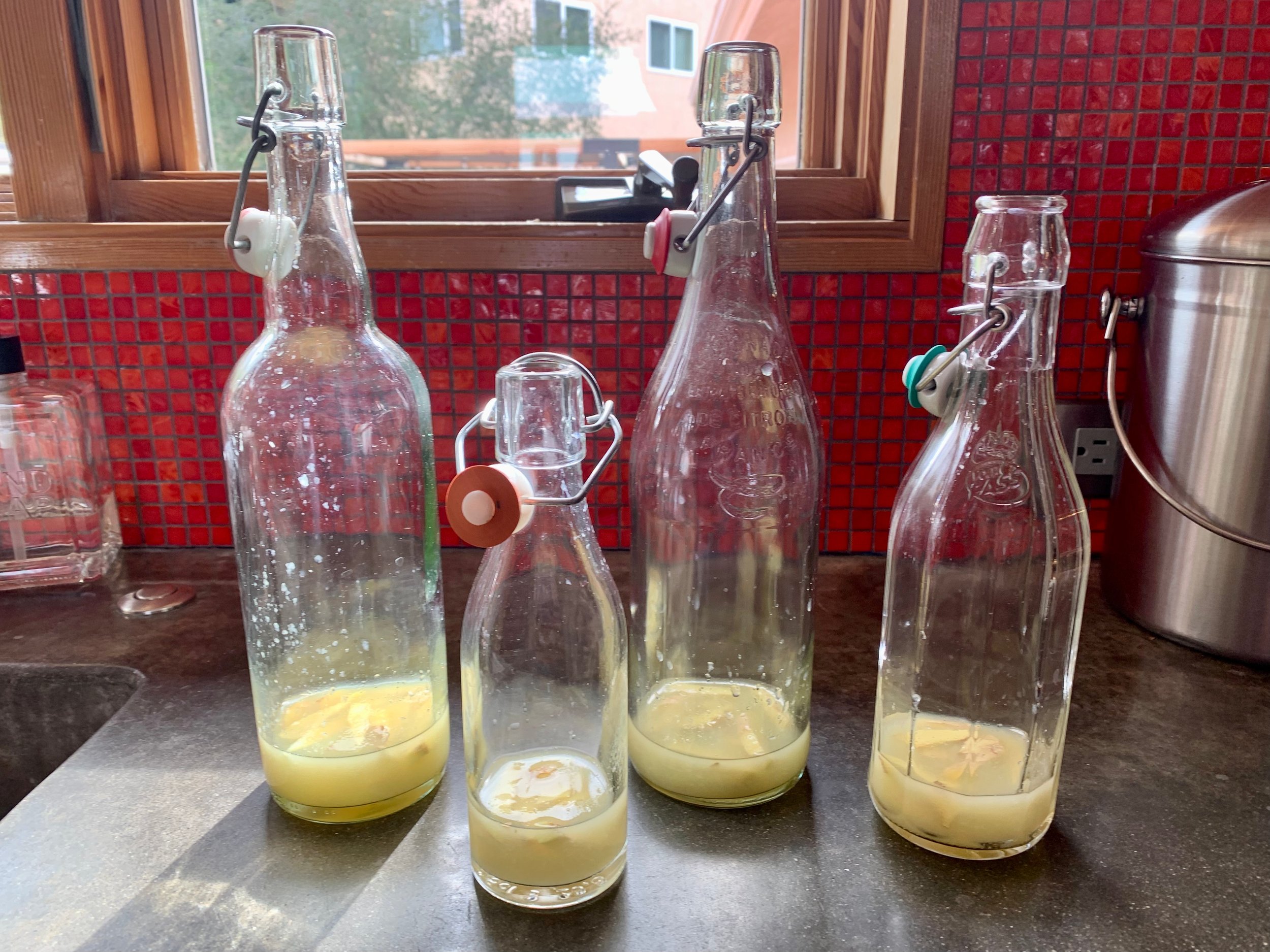 bottles with lemon juice and ginger