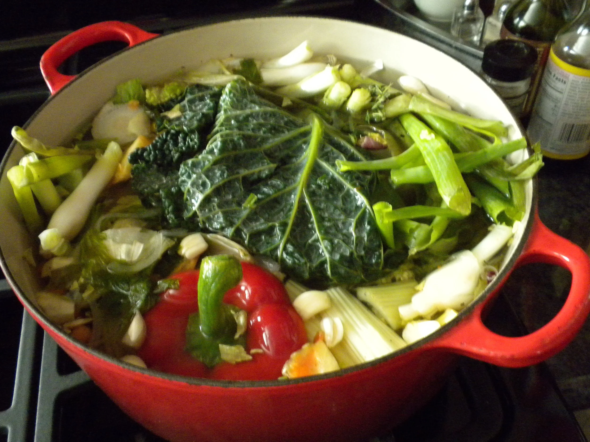 Soup pot filled with vegetable scraps.