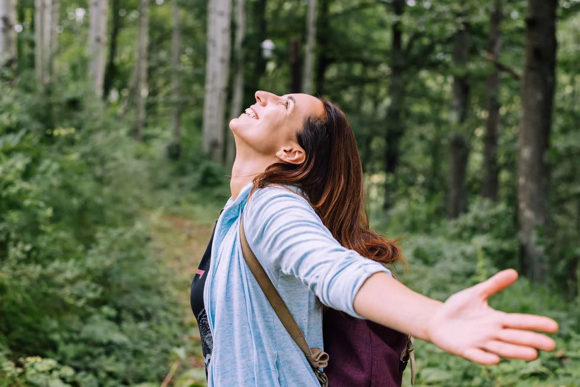 Woman enjoying nature in forest