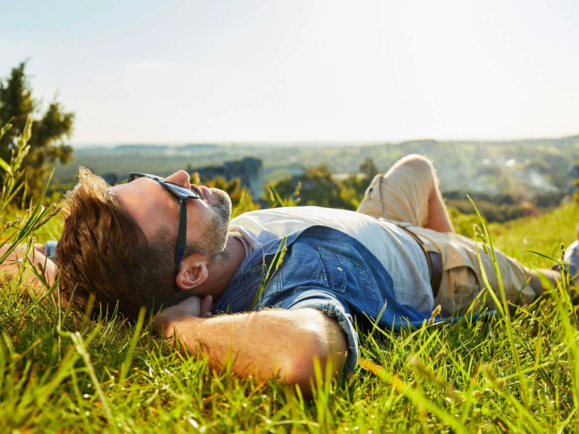 A man relaxing on the grass